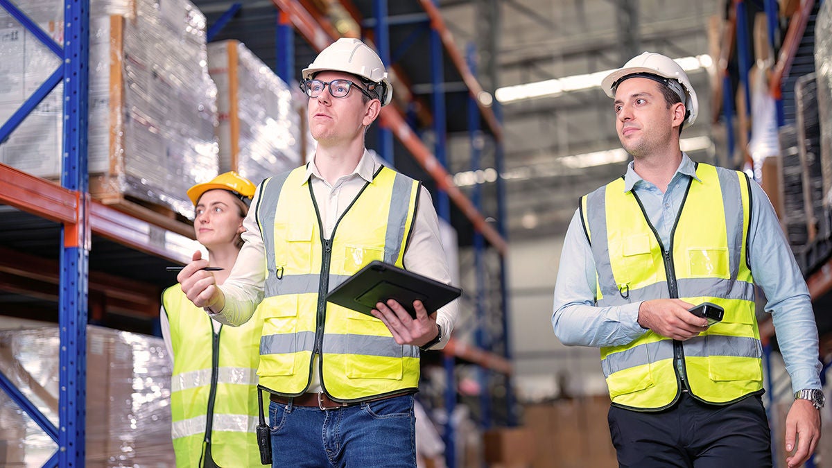 municpal warehouse workers using tablet