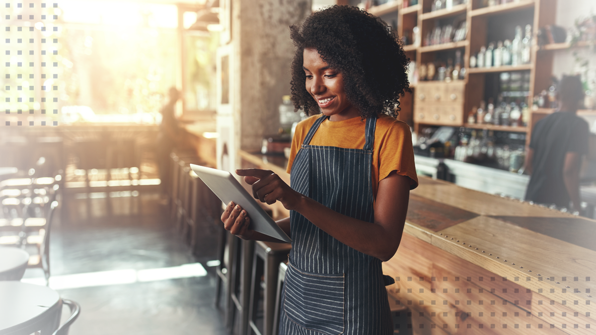 A female business owner using a tablet to grow her small business market