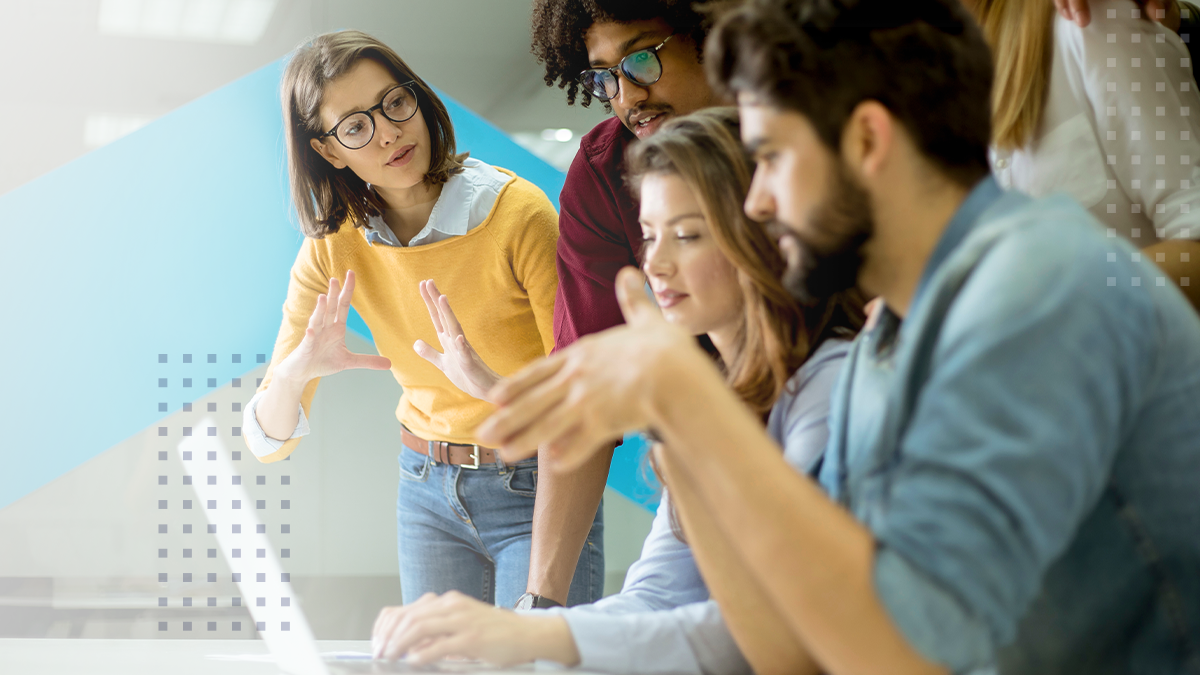 Group of young business people working and communicating together in creative office