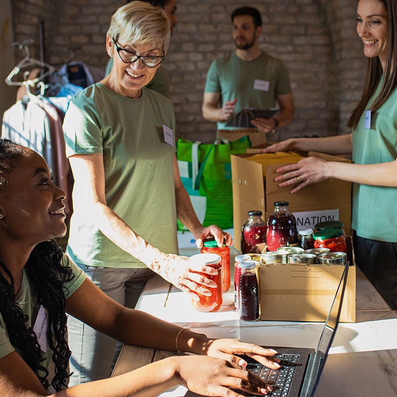 volunteers with laptop