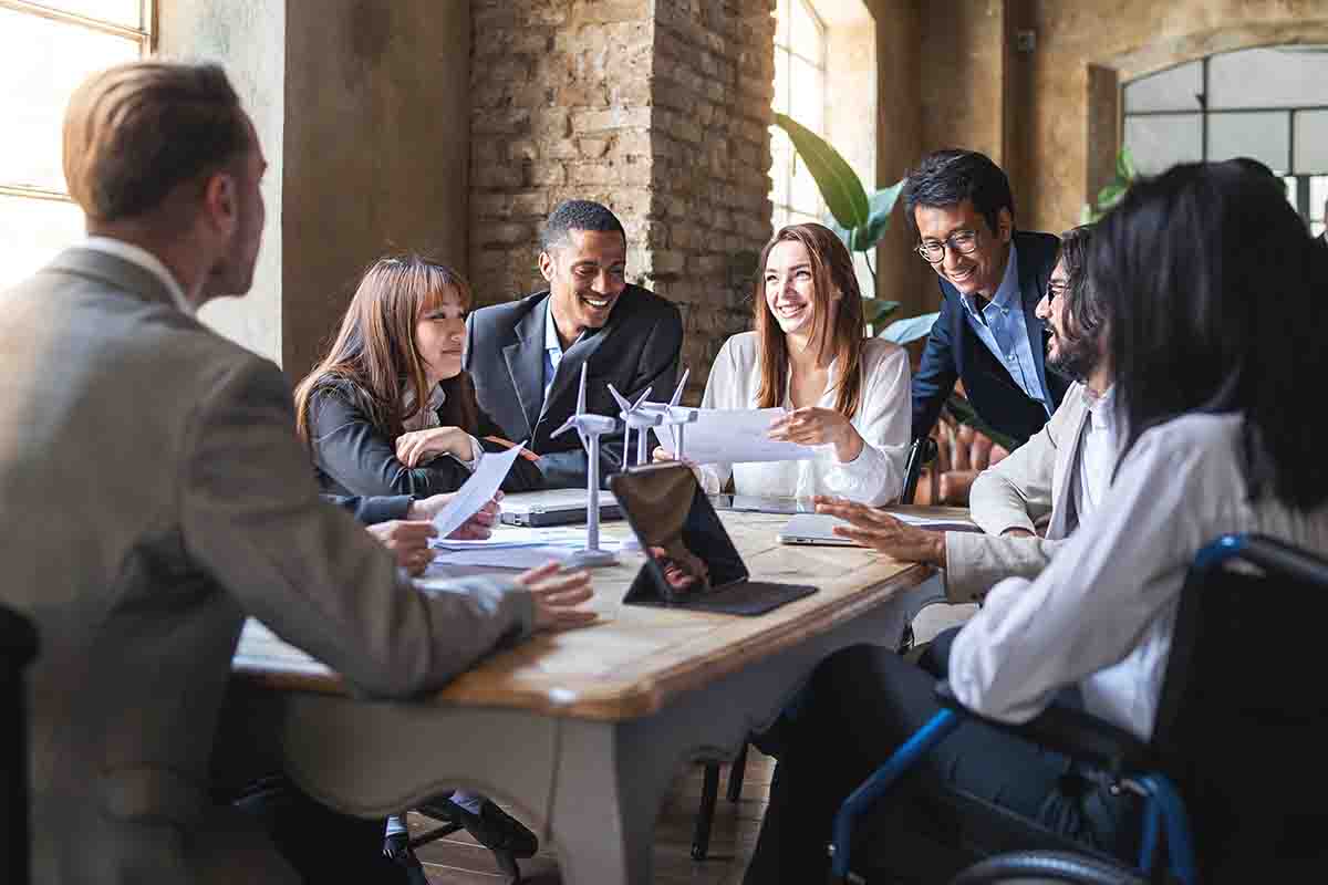 people meeting with green technology