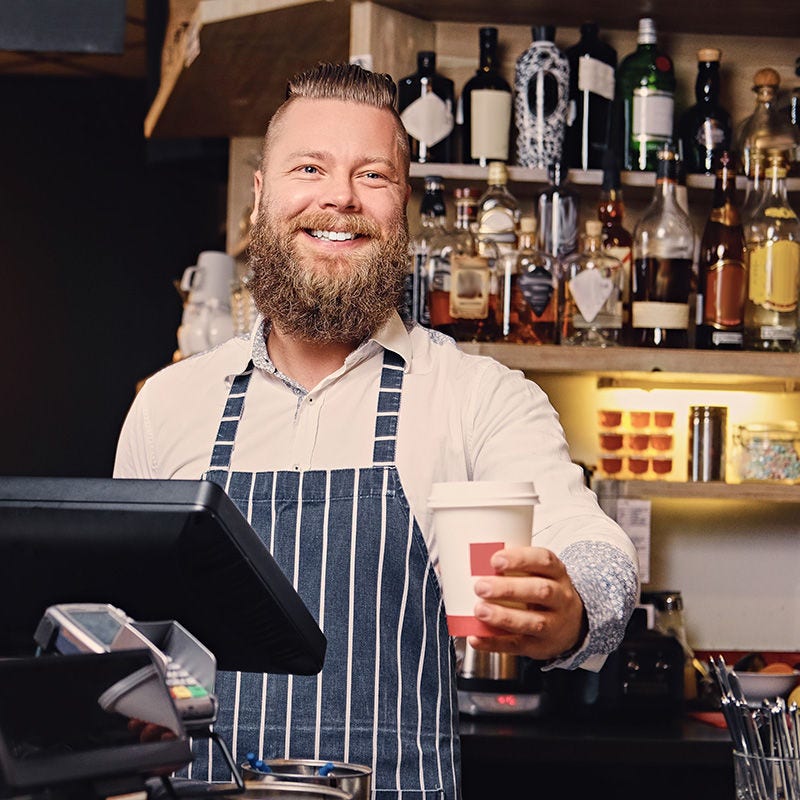 smiling coffee shop owner