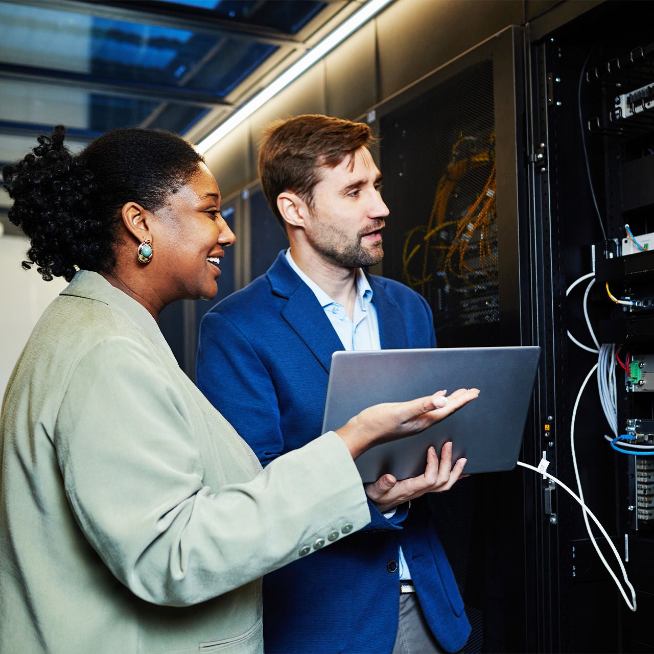 Two network engineers working on a server