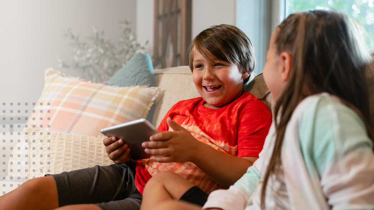 Smiling children with tablet