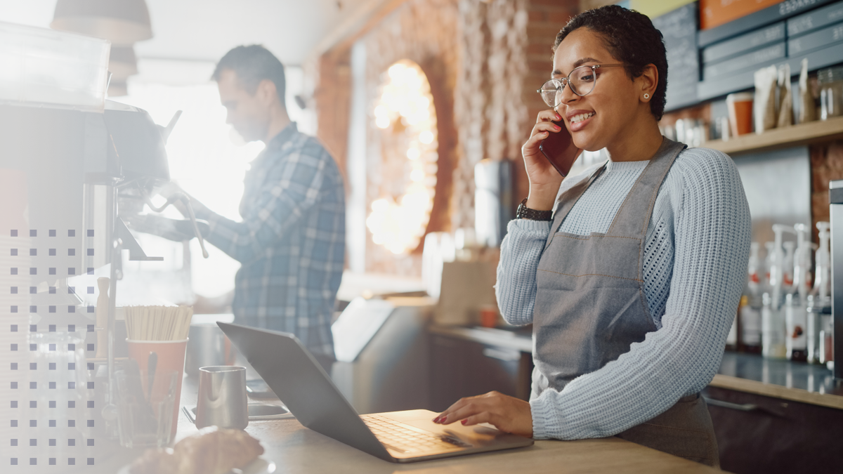 Worker at cafe with laptop