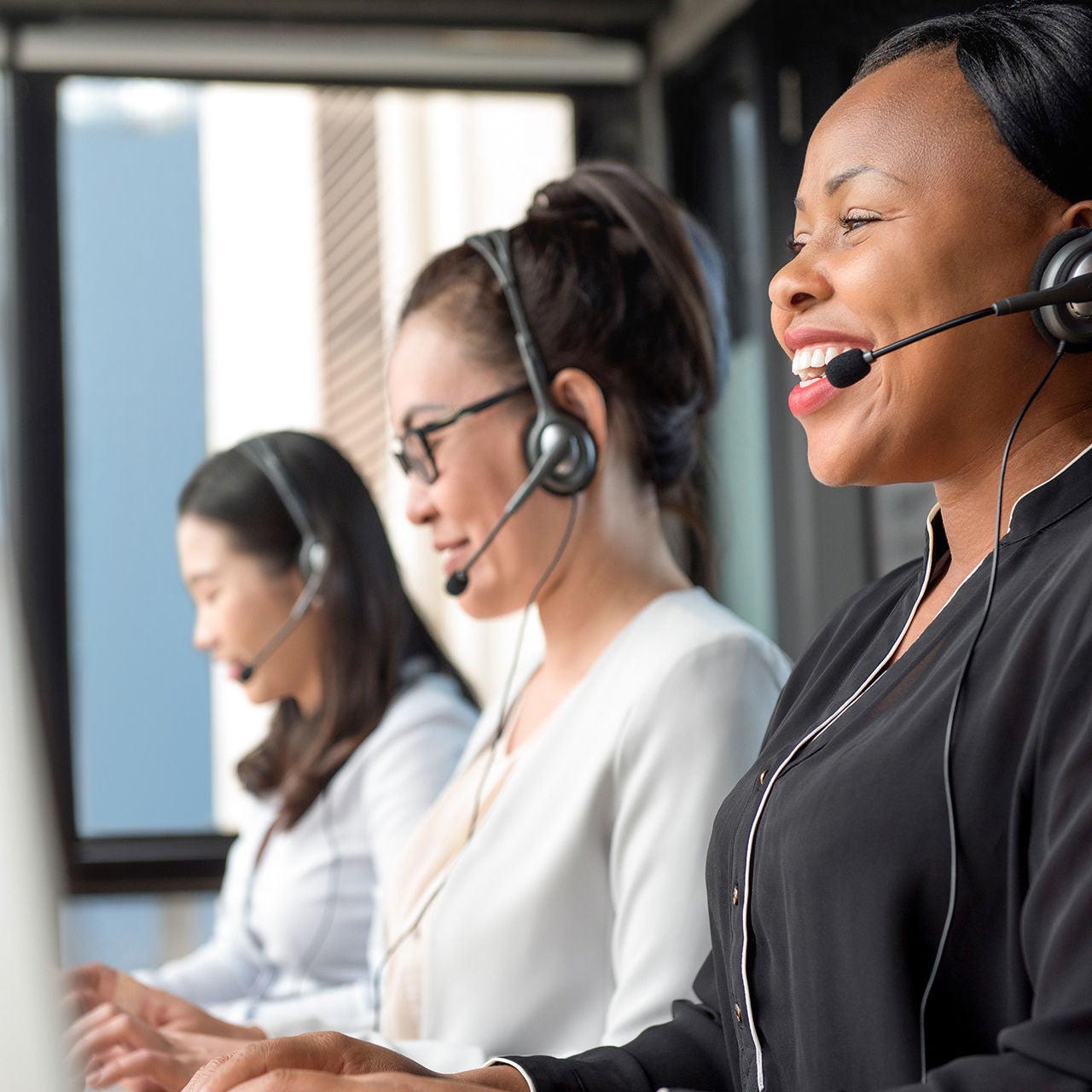 Happy employees with headsets