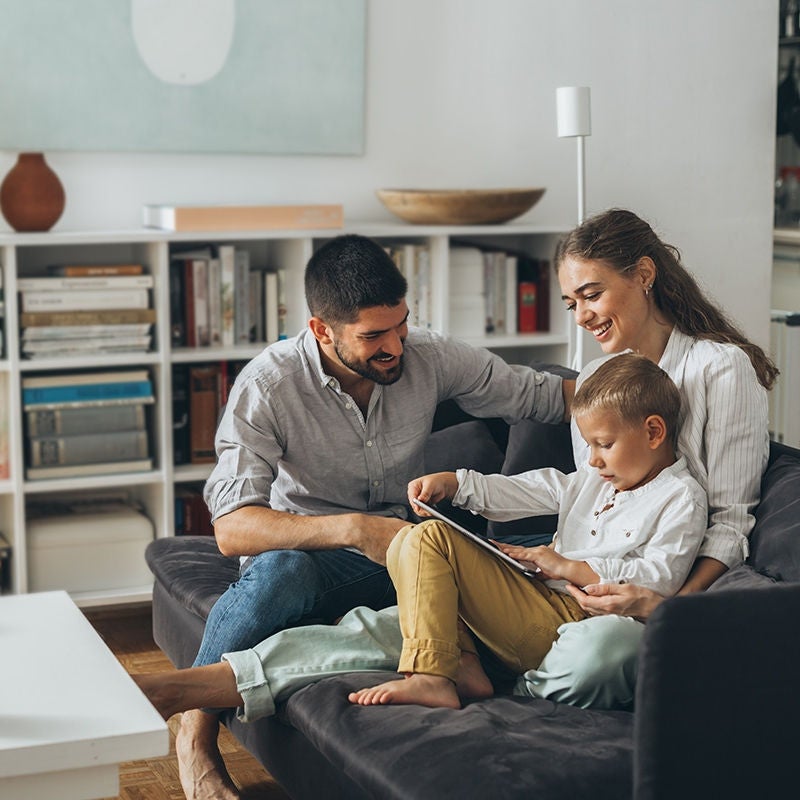 family at home on sofa