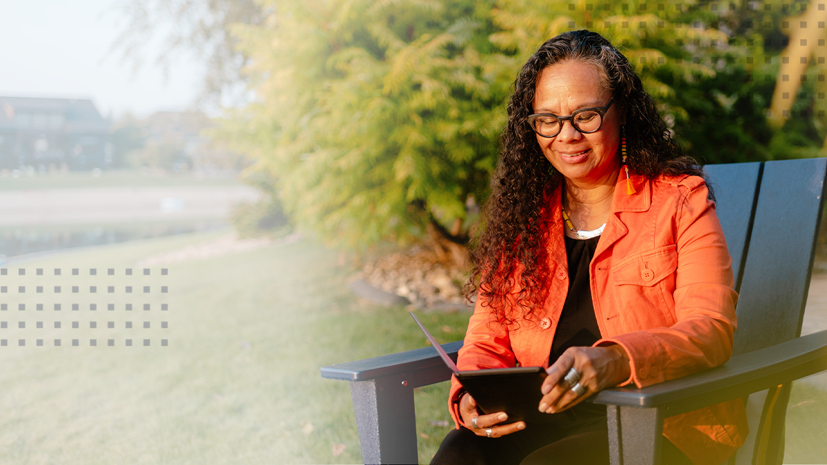 Woman outside with device